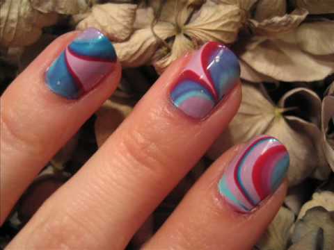 Step by step instructions on water marbling your nails by candy